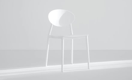 Chair and table in light room.